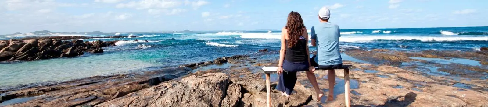 Walkers on rocks near Peaceful Bay